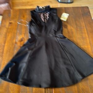 Trixxi NWT women’s size 3 dress. Black with keyhole front. New condition.